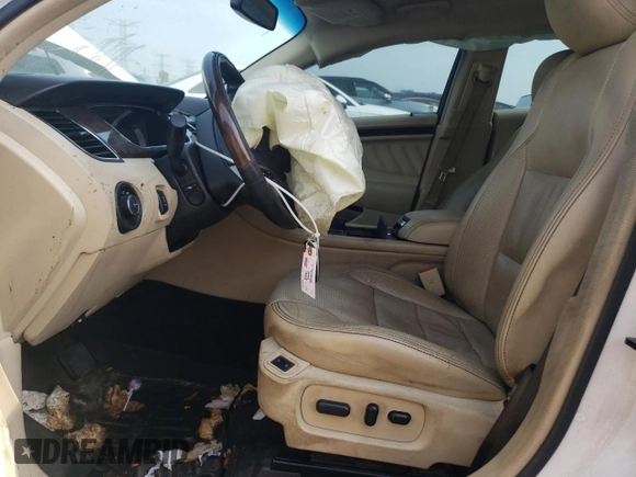 2016 Ford Taurus Limited with VIN 1FAHP2F8XGG124551, listed as a Copart auction lot 60621695 with 103,668 mi miles and Salvage title. Bid and sale history available at DreamBid. Image 7.