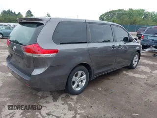 2014 Toyota Sienna L with VIN 5TDZK3DC5ES439593, listed as a IAAI auction lot 42420219 with 136,544 mi miles and . Bid and sale history available at DreamBid. Image 4.