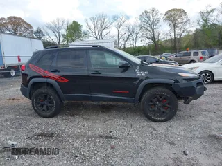 2015 Jeep Cherokee Trailhawk with VIN 1C4PJMBS5FW792184, listed as a IAAI auction lot 41827106 with 132,752 mi miles. Bid and sale history available at carsss.com. Image 13.