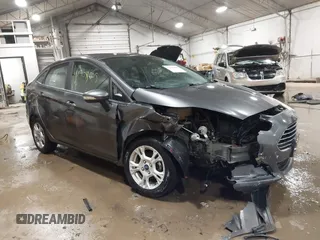 2015 Ford Fiesta SE with VIN 3FADP4BJ9FM164093, listed as a IAAI auction lot 41308905 with 75,839 mi miles. Bid and sale history available at carsss.com. Image 1.