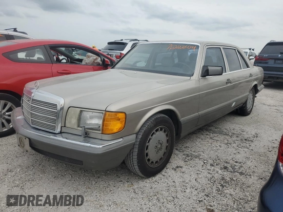 1989 Mercedes-Benz 560 with VIN WDBCA39E1KA479955, listed as a Copart auction lot 76202804 with 132,546 mi miles and Salvage Title. Bid and sale history available at DreamBid. Image 1.