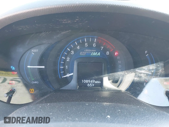2013 Honda Insight EX z VIN JHMZE2H70DS005200, wystawiony jako IAAI lot #42105624 z przebiegiem 108 949 mil mil oraz . Historia ofert i sprzedaży dostępna na DreamBid. Obrazek 7.
