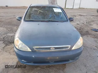 2002 Kia Rio with VIN KNADC123826128733, listed as a IAAI auction lot 41643123 with 101,433 mi miles. Bid and sale history available at carsss.com. Image 12.