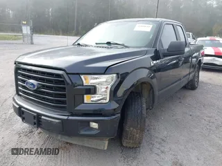 2015 Ford F-150 XL with VIN 1FTEX1CF2FKD12874, listed as a IAAI auction lot 41860610 with 242,215 mi miles. Bid and sale history available at carsss.com. Image 2.