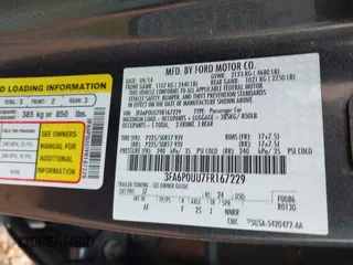 2015 Ford Fusion S Hybrid with VIN 3FA6P0UU7FR167229, listed as a IAAI auction lot 41684934 with 135,317 mi miles. Bid and sale history available at carsss.com. Image 9.