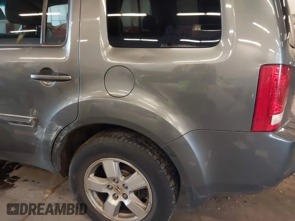 2011 Honda Pilot EX-L with VIN 5FNYF4H65BB020721, listed as a IAAI auction lot 41794436 with 113,630 mi miles and . Bid and sale history available at carsss.com. Image 21.