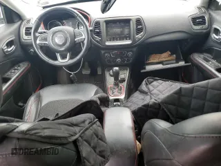2019 Jeep Compass Trailhawk with VIN 3C4NJDDB5KT671613, listed as a Copart auction lot 61023125 with 64,793 mi miles and Salvage title. Bid and sale history available at DreamBid. Image 8.
