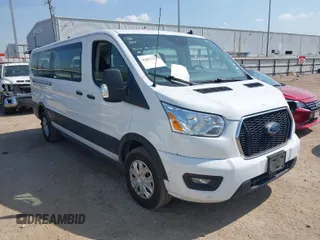 2022 Ford Transit Passenger XL with VIN 1FBAX2Y82NKA44247, listed as a IAAI auction lot 42057353 with 76,941 mi miles. Bid and sale history available at carsss.com. Image 1.