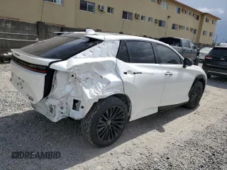 2023 Lexus RZ 450e Premium z VIN JTJAAAAB9PA011698, wystawiony jako Copart lot #64390964 z przebiegiem 12 303 mil mil oraz Szkody całkowita. Historia ofert i sprzedaży dostępna na DreamBid. Obrazek 3.