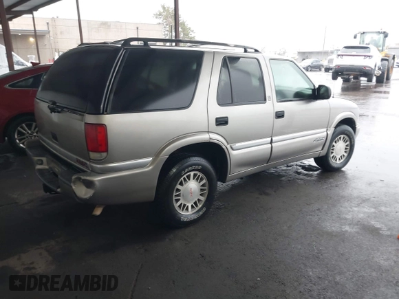 1999 GMC Jimmy SLE with VIN 1GKDT13W7X2529298, listed as a IAAI auction lot 41556249 with 114,750 mi miles. Bid and sale history available at carsss.com. Image 4.