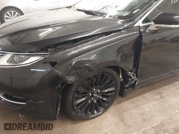 2015 Lincoln MKZ z VIN 3LN6L2J95FR620390, wystawiony jako IAAI lot #41586267 z przebiegiem 127 870 mil mil oraz . Historia ofert i sprzedaży dostępna na DreamBid. Obrazek 6.