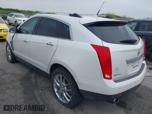 2013 Cadillac SRX Performance Collection z VIN 3GYFNHE35DS569528, wystawiony jako IAAI lot #42329652 z przebiegiem 97 184 mil mil oraz . Historia ofert i sprzedaży dostępna na DreamBid. Obrazek 3.