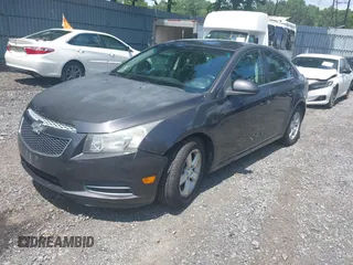 2014 Chevrolet Cruze 1LT with VIN 1G1PC5SB2E7288693, listed as a IAAI auction lot 42728884 with 149,050 mi miles and . Bid and sale history available at DreamBid. Image 2.