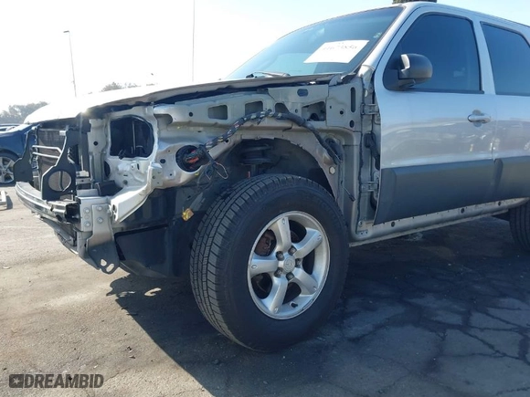 2006 Mazda Tribute i with VIN 4F2YZ02Z26KM38777, listed as a IAAI auction lot 41673856 with 165,665 mi miles. Bid and sale history available at carsss.com. Image 6.