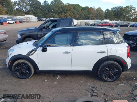 2015 MINI Countryman S with VIN WMWZC3C5XFWT06360, listed as a IAAI auction lot 40774863 with 127,383 mi miles and . Bid and sale history available at DreamBid. Image 14.
