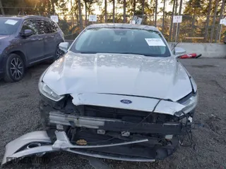 2015 Ford Fusion Energi Titanium with VIN 3FA6P0SU8FR264846, listed as a IAAI auction lot 41552443 with 160,142 mi miles. Bid and sale history available at carsss.com. Image 12.
