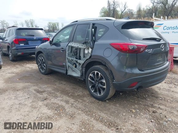 2016 Mazda CX-5 Grand Touring with VIN JM3KE4DYXG0830150, listed as a IAAI auction lot 41961007 with 142,570 mi miles and . Bid and sale history available at DreamBid. Image 3.