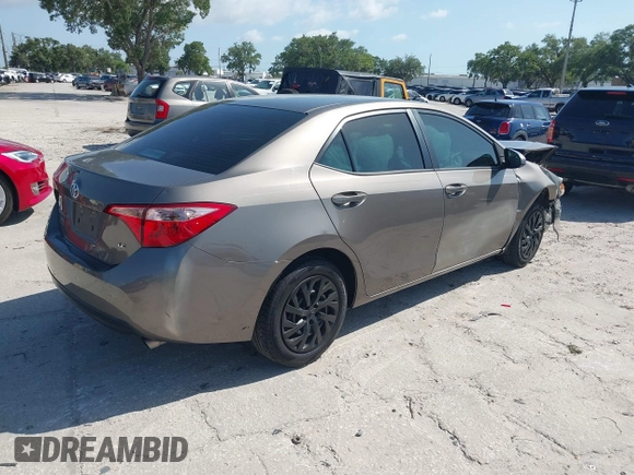 2019 Toyota Corolla L with VIN 5YFBURHE7KP878972, listed as a IAAI auction lot 42000888 with 201,612 mi miles. Bid and sale history available at carsss.com. Image 4.