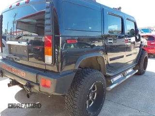 2004 Hummer H2 with VIN 5GRGN23U64H101592, listed as a IAAI auction lot 41379405 with 174,672 mi miles. Bid and sale history available at carsss.com. Image 4.