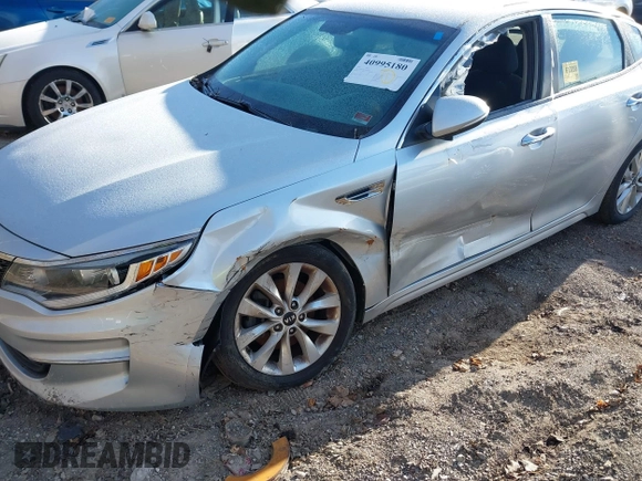 2016 Kia Optima LX with VIN 5XXGT4L35GG059931, listed as a IAAI auction lot 40995180 with 130,596 mi miles. Bid and sale history available at carsss.com. Image 6.