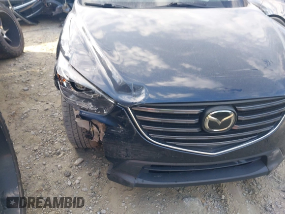 2016 Mazda CX-5 Grand Touring with VIN JM3KE2DY1G0708572, listed as a IAAI auction lot 41685298 with 109,427 mi miles. Bid and sale history available at carsss.com. Image 6.