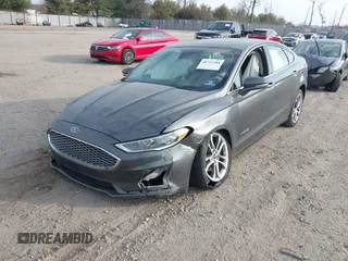 2019 Ford Fusion Hybrid Titanium with VIN 3FA6P0RU9KR158129, listed as a IAAI auction lot 41717104 with 37,736 mi miles. Bid and sale history available at carsss.com. Image 2.