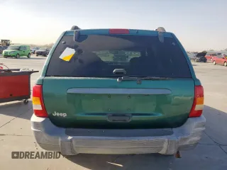 1999 Jeep Grand Cherokee Laredo with VIN 1J4G258S0XC561054, listed as a Copart auction lot 49814555 with Not provided miles and Salvage title. Bid and sale history available at DreamBid. Image 6.
