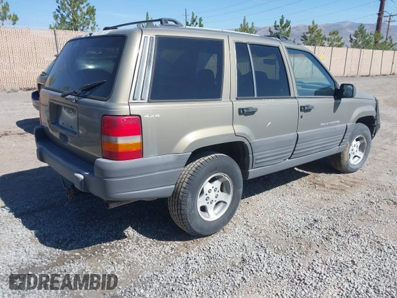 1997 Jeep Grand Cherokee Laredo with VIN 1J4GZ58S3VC603239, listed as a IAAI auction lot 42593915 with 295,696 mi miles and . Bid and sale history available at DreamBid. Image 4.