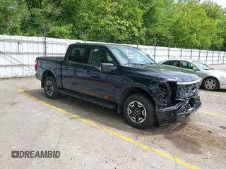 2023 Ford F-150 Lightning Pro with VIN 1FTVW1EL6PWG30061, listed as a IAAI auction lot 42362295 with 22,481 mi miles and . Bid and sale history available at DreamBid. Image 1.