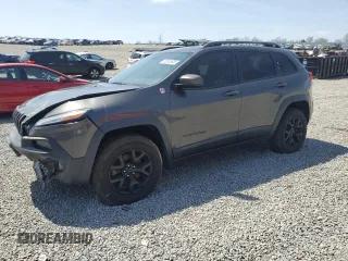 2015 Jeep Cherokee Trailhawk with VIN 1C4PJMBS2FW610618, listed as a Copart auction lot 52243625 with 136,234 mi miles and Salvage title. Bid and sale history available at DreamBid. Image 1.