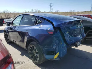 2023 Tesla Model Y Long Range with VIN 7SAYGAEE6PF689615, listed as a Copart auction lot 50999385 with 16,514 mi miles and Salvage Title. Bid and sale history available at DreamBid. Image 2.