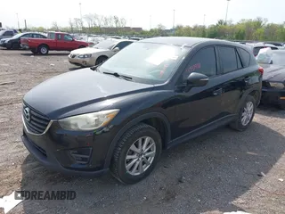 2016 Mazda CX-5 Sport with VIN JM3KE4BY8G0746377, listed as a IAAI auction lot 41990988 with 144,558 mi miles and . Bid and sale history available at carsss.com. Image 2.