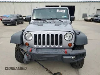 2013 Jeep Wrangler Unlimited Rubicon 10th Anniversary z VIN 1C4HJWFG3DL703331, wystawiony jako Copart lot #70823154 z przebiegiem 148 860 mil mil oraz Szkoda całkowita • Salvage title. Historia ofert i sprzedaży dostępna na DreamBid. Obrazek 5.