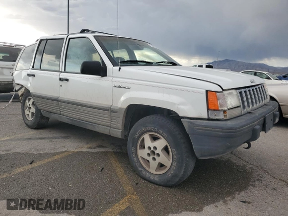 1995 Jeep Grand Cherokee Laredo with VIN 1J4GZ58Y6SC718918, listed as a Copart auction lot 72226394 with 212,670 mi miles and Salvage Title. Bid and sale history available at carsss.com. Image 4.