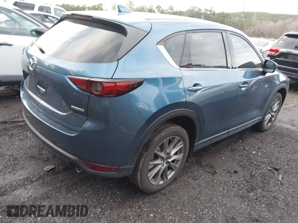 2020 Mazda CX-5 Grand Touring with VIN JM3KFADM4L0827733, listed as a IAAI auction lot 41482517 with 43,597 mi miles. Bid and sale history available at carsss.com. Image 4.
