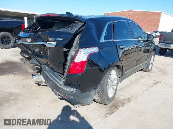 2019 Cadillac XT5 FWD with VIN 1GYKNARS7KZ117913, listed as a IAAI auction lot 41228767 with 105,335 mi miles and . Bid and sale history available at carsss.com. Image 4.