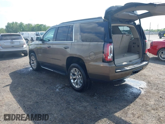 2016 GMC Yukon SLT with VIN 1GKS1BKC9GR328861, listed as a IAAI auction lot 42010839 with 200,711 mi miles. Bid and sale history available at carsss.com. Image 3.