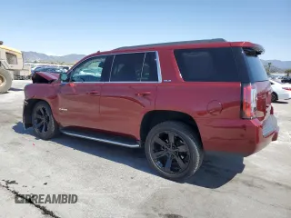 2019 GMC Yukon SLE with VIN 1GKS1AKC9KR355643, listed as a Copart auction lot 52050855 with 50,729 mi miles and Salvage Title. Bid and sale history available at carsss.com. Image 2.