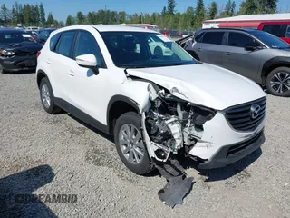 2016 Mazda CX-5 Sport with VIN JM3KE2BY1G0873962, listed as a IAAI auction lot 42438331 with 86,181 mi miles and . Bid and sale history available at DreamBid. Image 1.