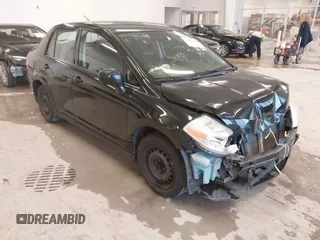 2009 Nissan Versa 1.8 S with VIN 3N1BC11E99L438342, listed as a IAAI auction lot 41561812 with 152,141 mi miles. Bid and sale history available at carsss.com. Image 1.