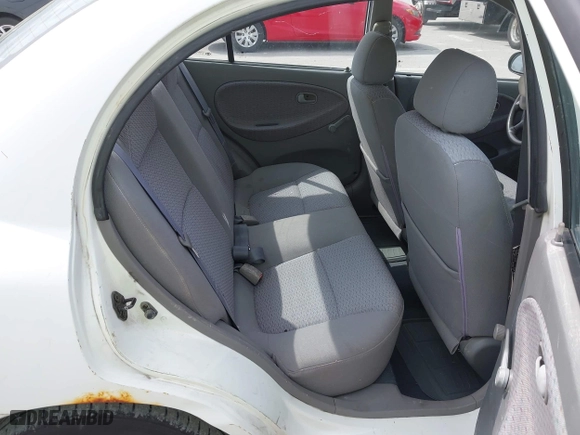 2002 Kia Rio with VIN KNADC123926185376, listed as a IAAI auction lot 42027348 with 84,893 mi miles. Bid and sale history available at carsss.com. Image 8.