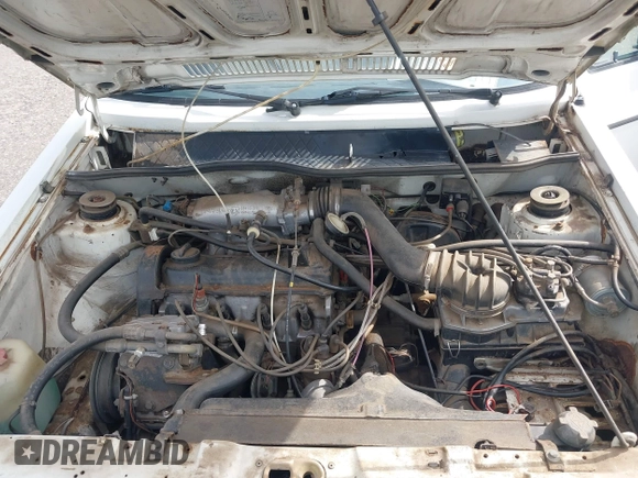 1982 Volkswagen Jetta z VIN WVWGA9161CW521961, wystawiony jako IAAI lot #42373314 z przebiegiem 52 051 mil mil oraz . Historia ofert i sprzedaży dostępna na DreamBid. Obrazek 10.