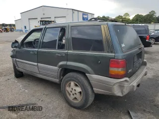 1995 Jeep Grand Cherokee Laredo with VIN 1J4FX58S0SC726476, listed as a Copart auction lot 69608784 with 264,705 mi miles and Salvage Title. Bid and sale history available at carsss.com. Image 2.