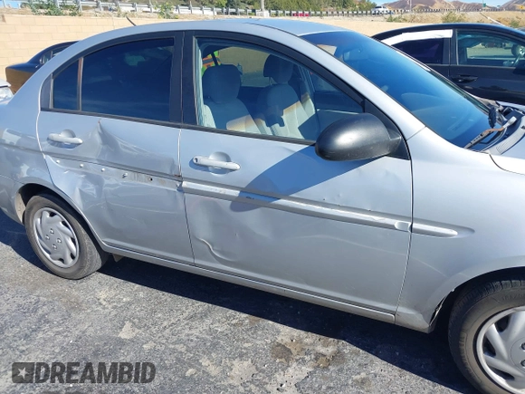 2006 Hyundai Accent GLS with VIN KMHCN46C16U023680, listed as a IAAI auction lot 41253207 with 157,398 mi miles. Bid and sale history available at carsss.com. Image 6.