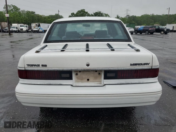 1992 Mercury Topaz GS z VIN 2MEPM36U1NB611321, wystawiony jako Copart lot #56950595 z przebiegiem 54 164 mil mil oraz Szkoda całkowita • Salvage title. Historia ofert i sprzedaży dostępna na DreamBid. Obrazek 6.