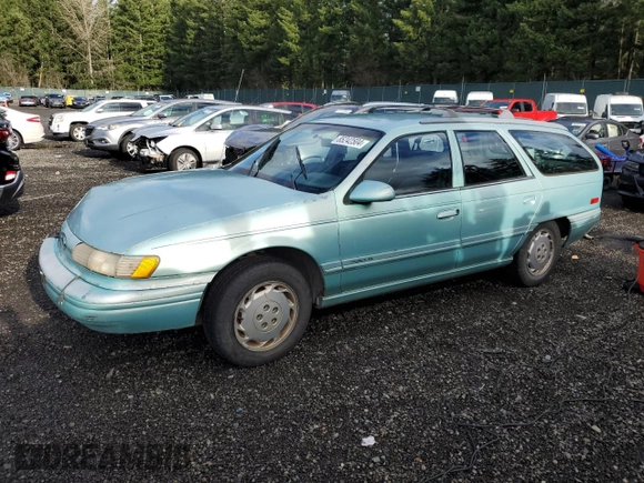 1994 Ford Taurus with VIN 1FALP5747RG236623, listed as a Copart auction lot 85242504 with 205,550 mi miles and Salvage title. Bid and sale history available at DreamBid. Image 1.