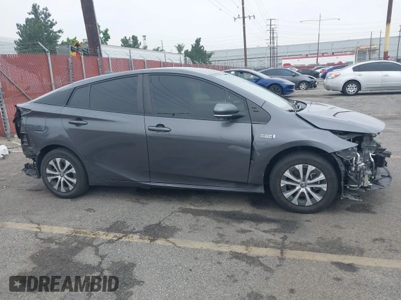 2021 Toyota Prius LE with VIN JTDKAMFP4M3194053, listed as a IAAI auction lot 42441091 with 47,290 mi miles and . Bid and sale history available at DreamBid. Image 14.