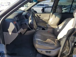 1999 Jeep Grand Cherokee Laredo with VIN 1J4GW58N9XC633464, listed as a Copart auction lot 84682454 with 212,738 mi miles and Salvage Title. Bid and sale history available at carsss.com. Image 7.