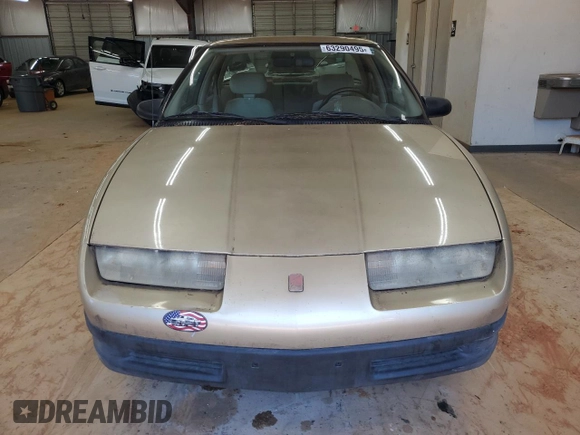 1995 Saturn SL with VIN 1G8ZH5280SZ302560, listed as a Copart auction lot 63290495 with 123,475 mi miles and Clean title. Bid and sale history available at DreamBid. Image 5.
