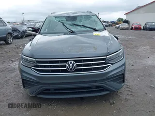 2022 Volkswagen Tiguan S with VIN 3VV1B7AX9NM005125, listed as a IAAI auction lot 42371110 with 94,060 mi miles and . Bid and sale history available at DreamBid. Image 12.